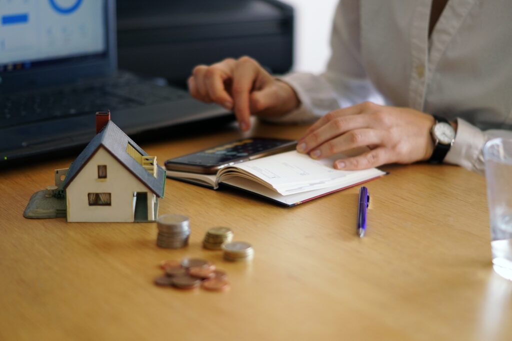 closeup shot of a person thinking of buying or selling a house closeup shot of a person thinking of buying or selling a house